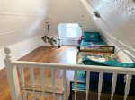 Attic bedroom has 2 daybeds with trundles offering flexible sleeping options